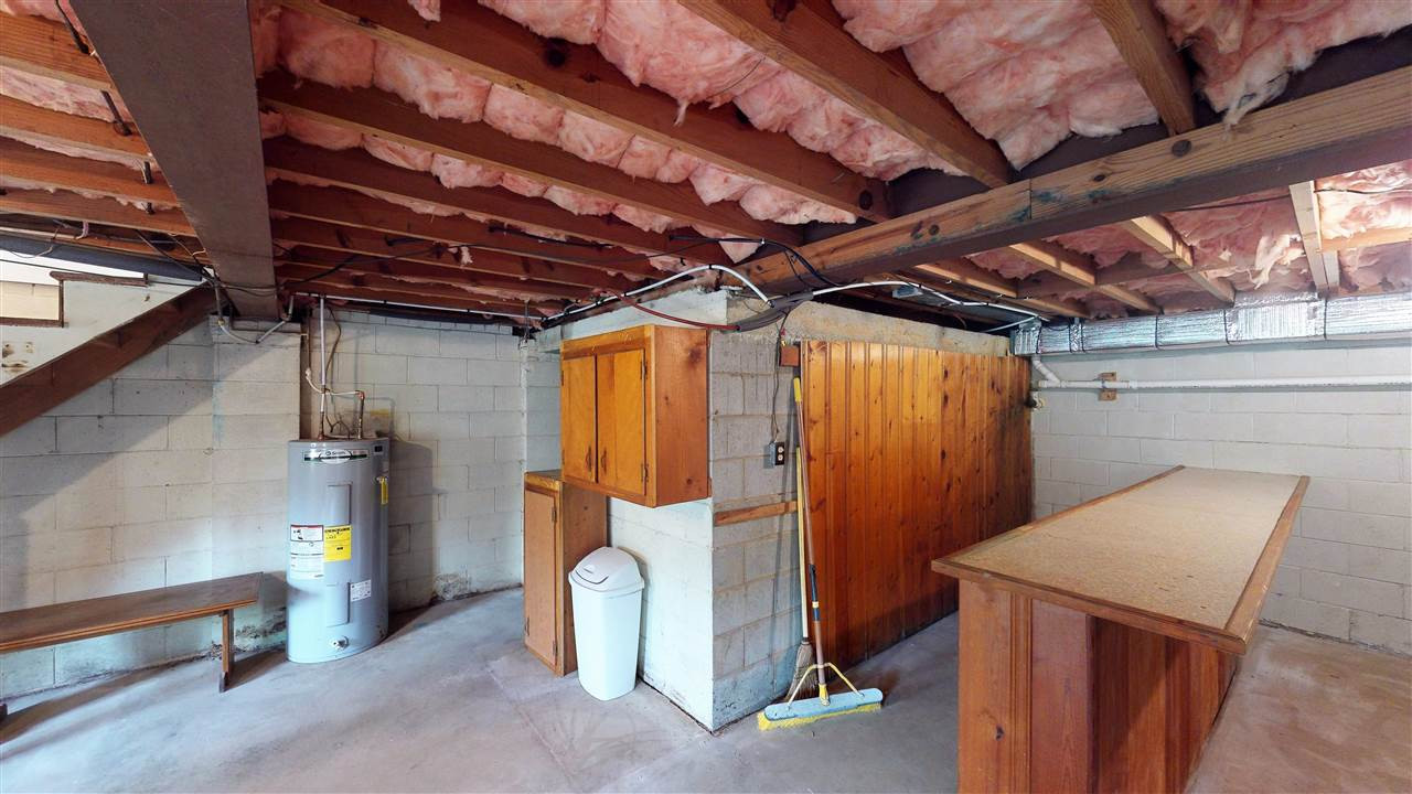 108 Rand Road Raleigh, NC 27603 - Photo 21 of 29 Another view of a small portion of this jumbo basement. The Bar conveys! There is a small room to the left which would make an awesome wine cellar. Basement
