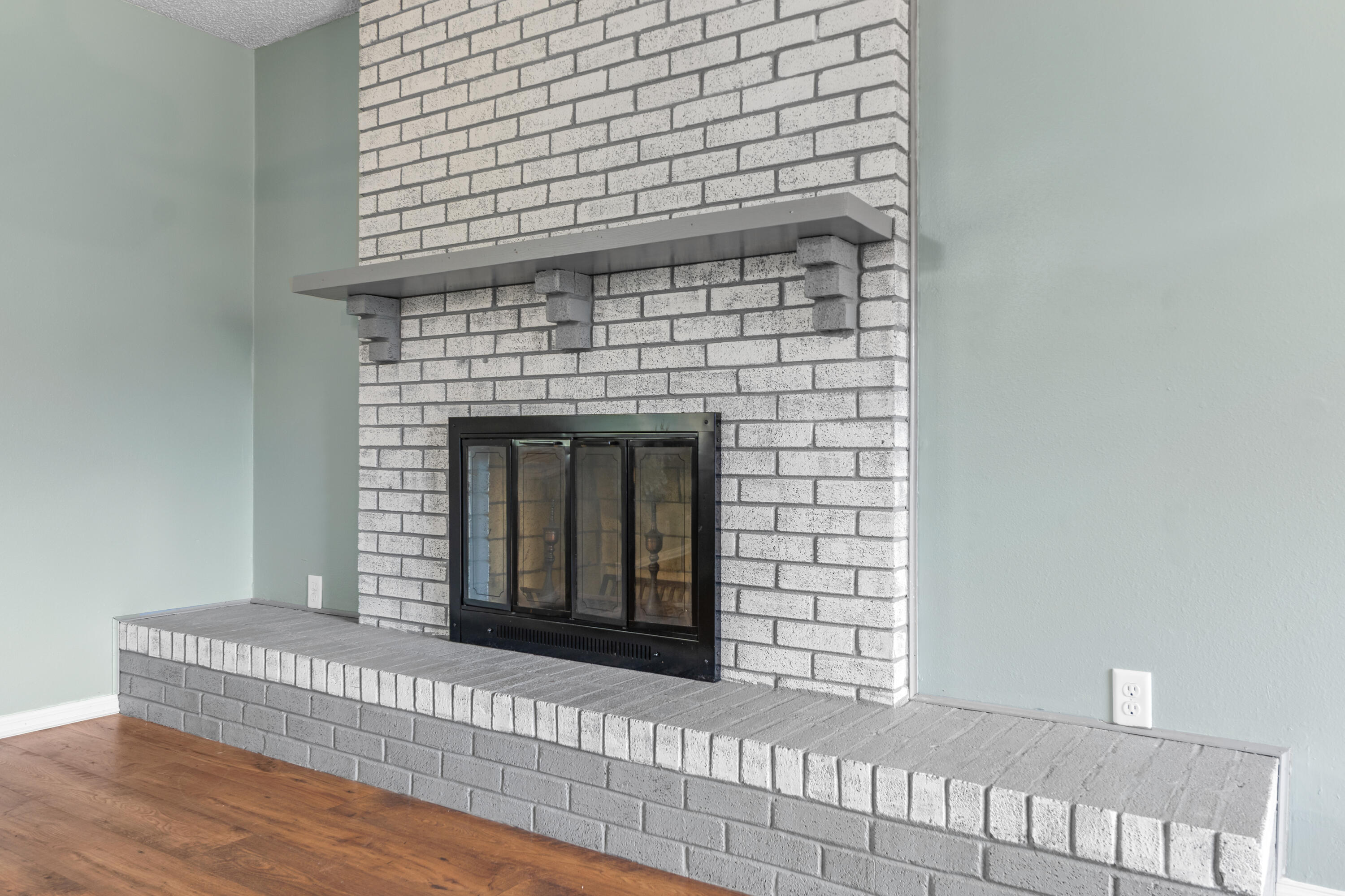 4320 Reinsma Road Milton, FL 32583 - Photo 11 of 41 a view of a fireplace with wooden floor