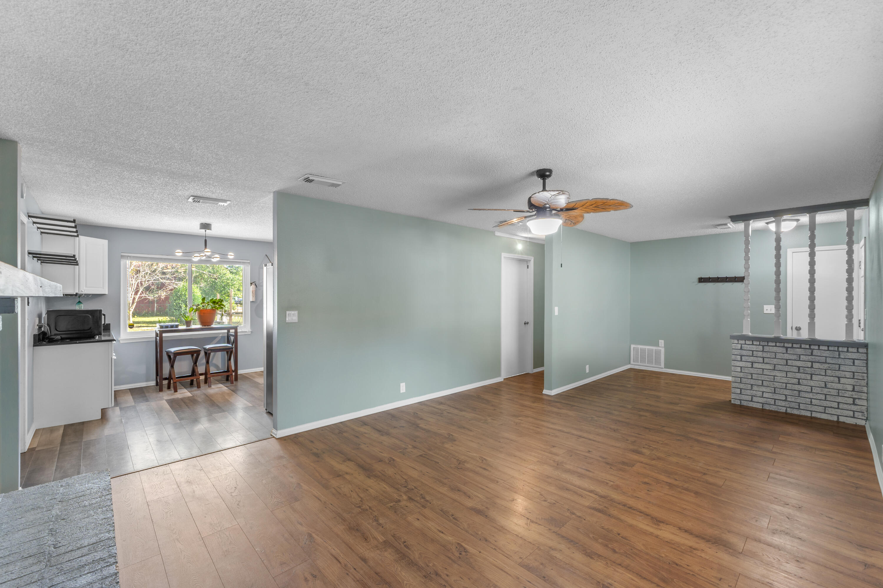 4320 Reinsma Road Milton, FL 32583 - Photo 13 of 41 a view of livingroom with hardwood floor and a ceiling fan