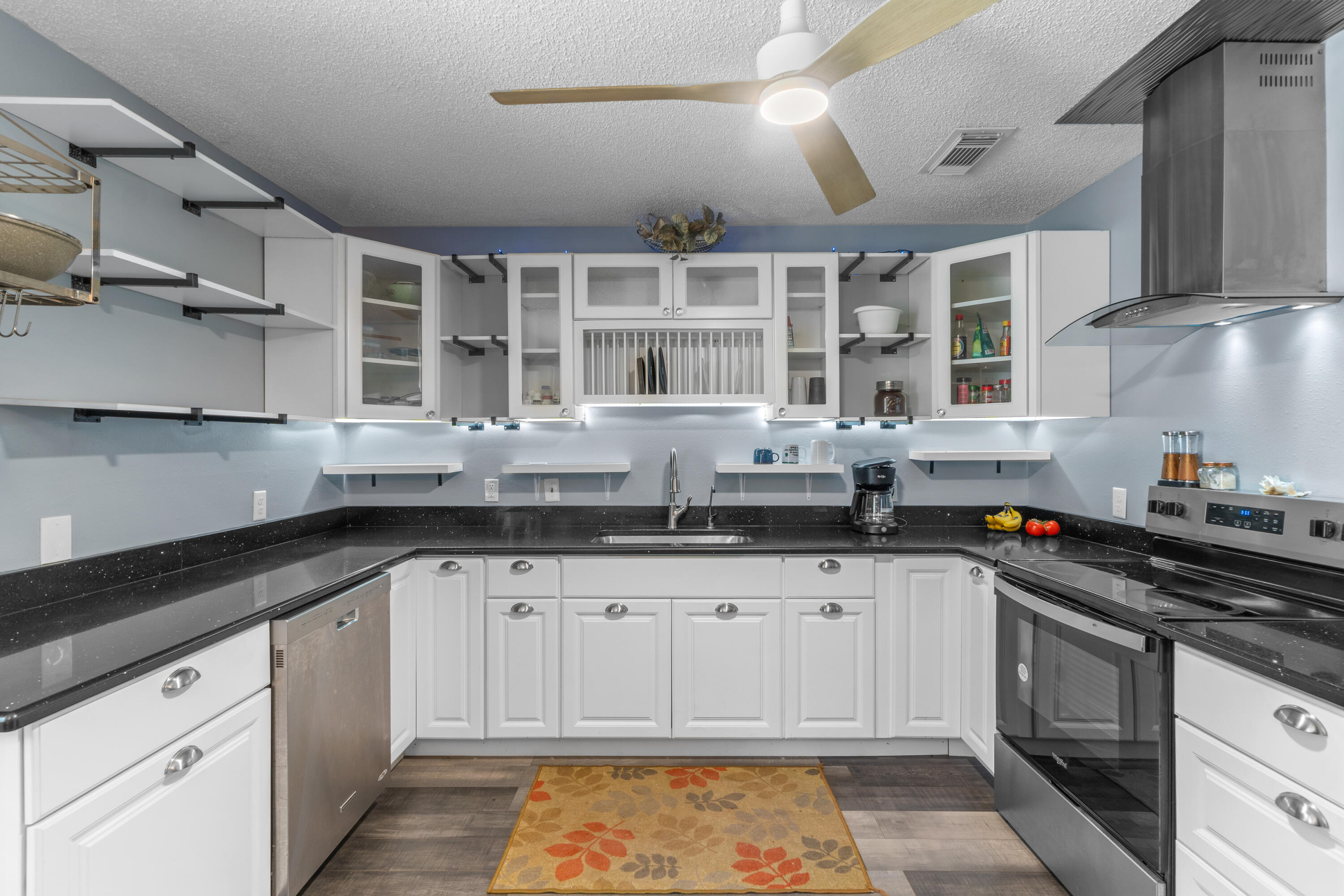 4320 Reinsma Road Milton, FL 32583 - Photo 17 of 41 a kitchen with granite countertop a sink stainless steel appliances and cabinets