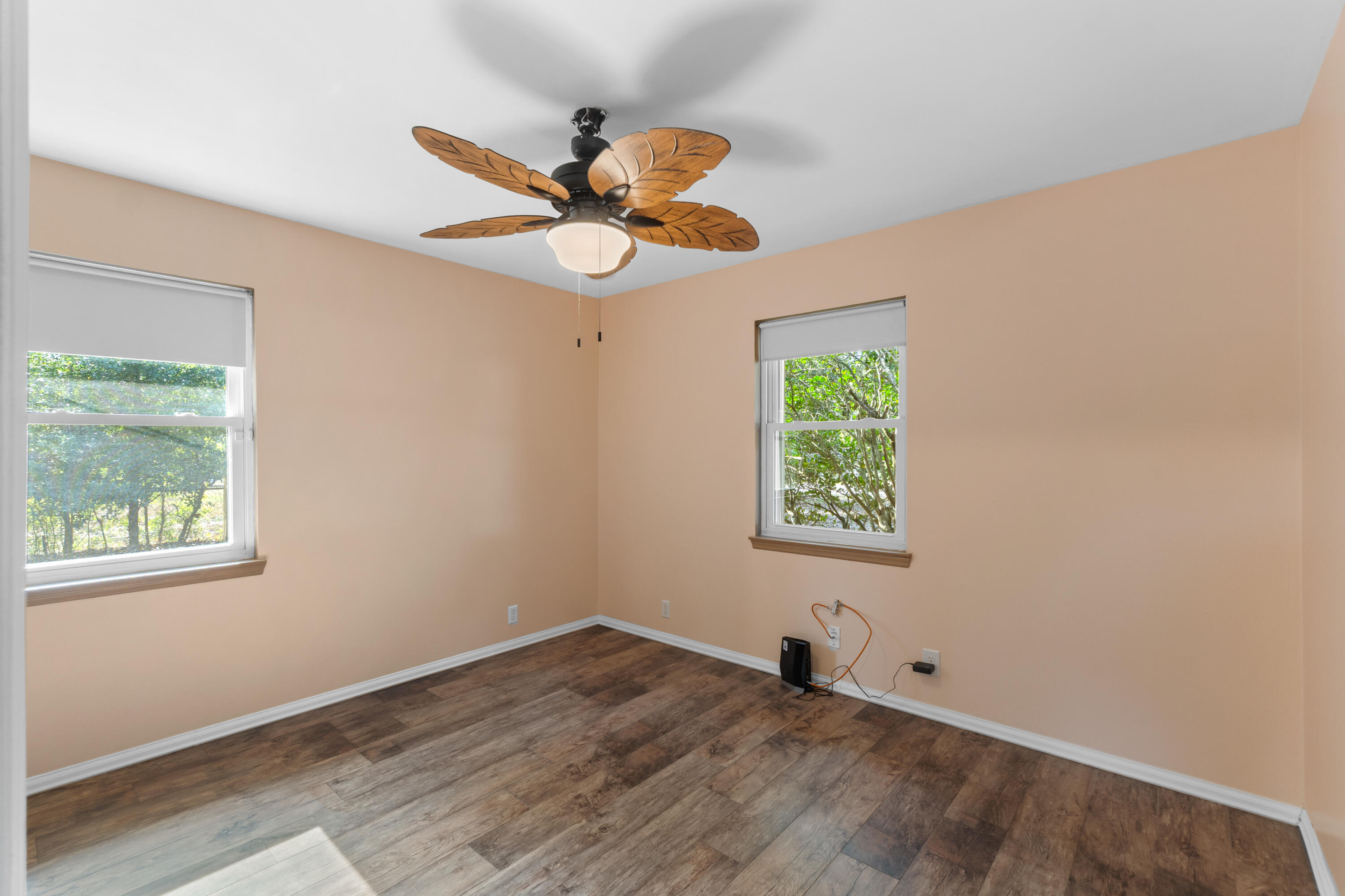 4320 Reinsma Road Milton, FL 32583 - Photo 20 of 41 a view of an empty room with wooden floor and window