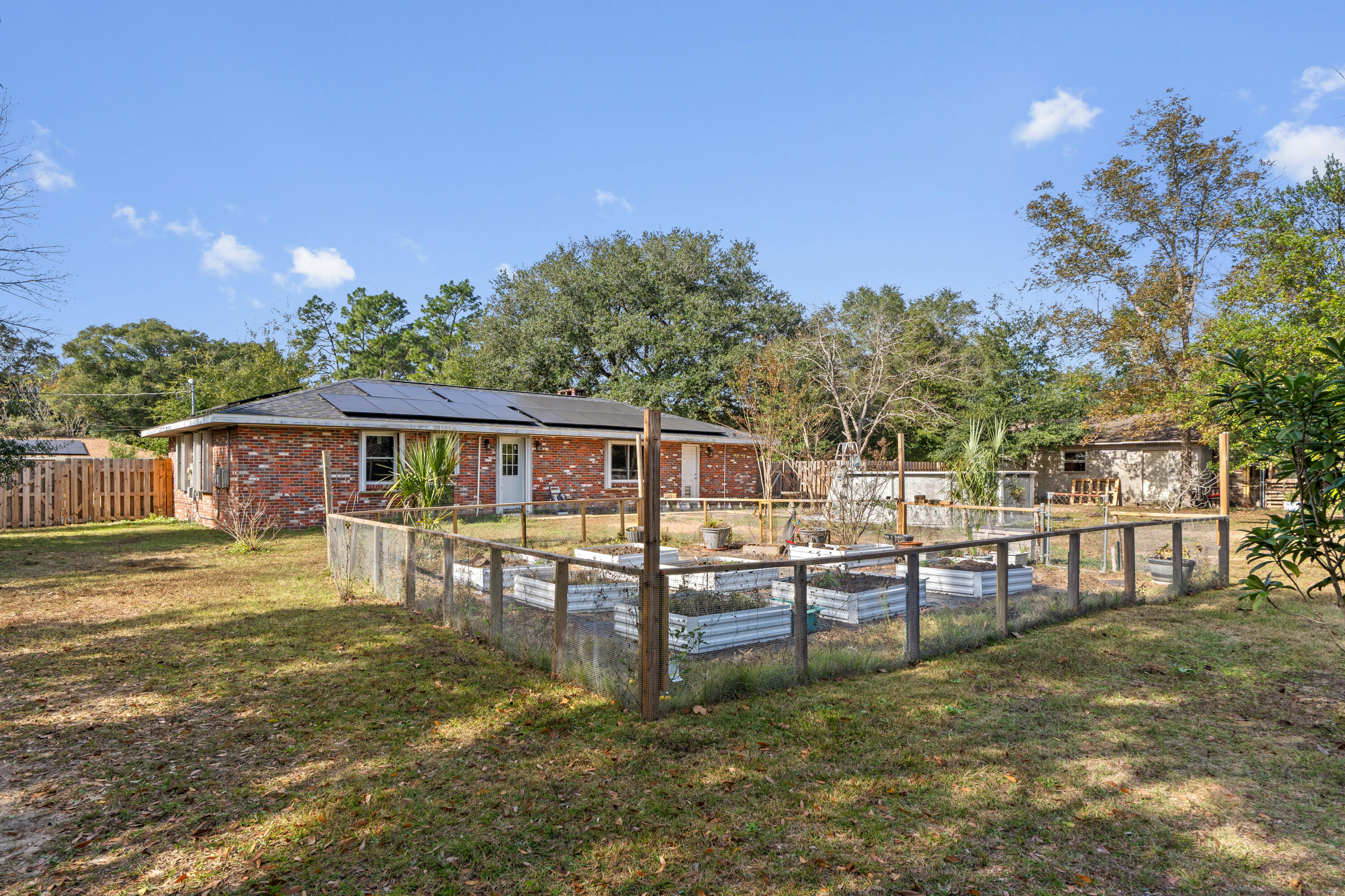 4320 Reinsma Road Milton, FL 32583 - Photo 2 of 41 a view of a house with a yard