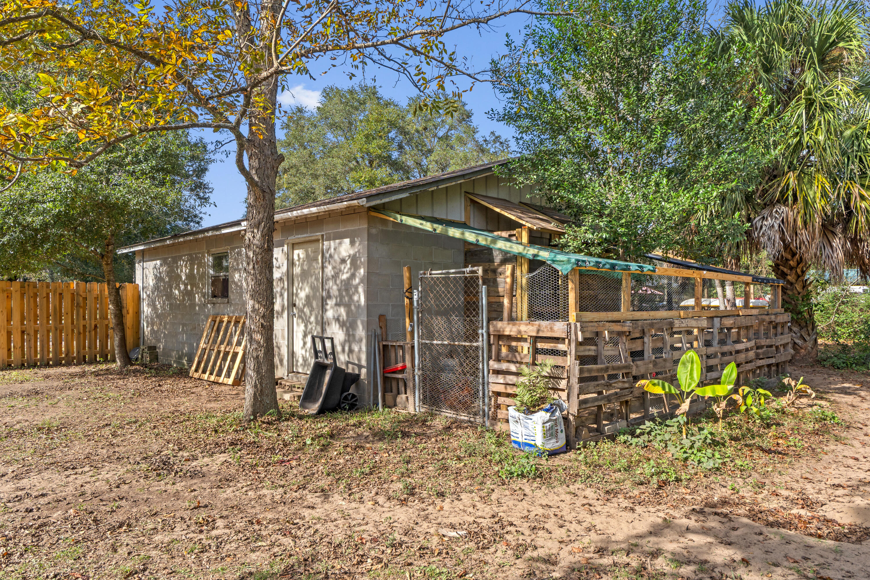 4320 Reinsma Road Milton, FL 32583 - Photo 34 of 41 a view of a chair and table in backyard