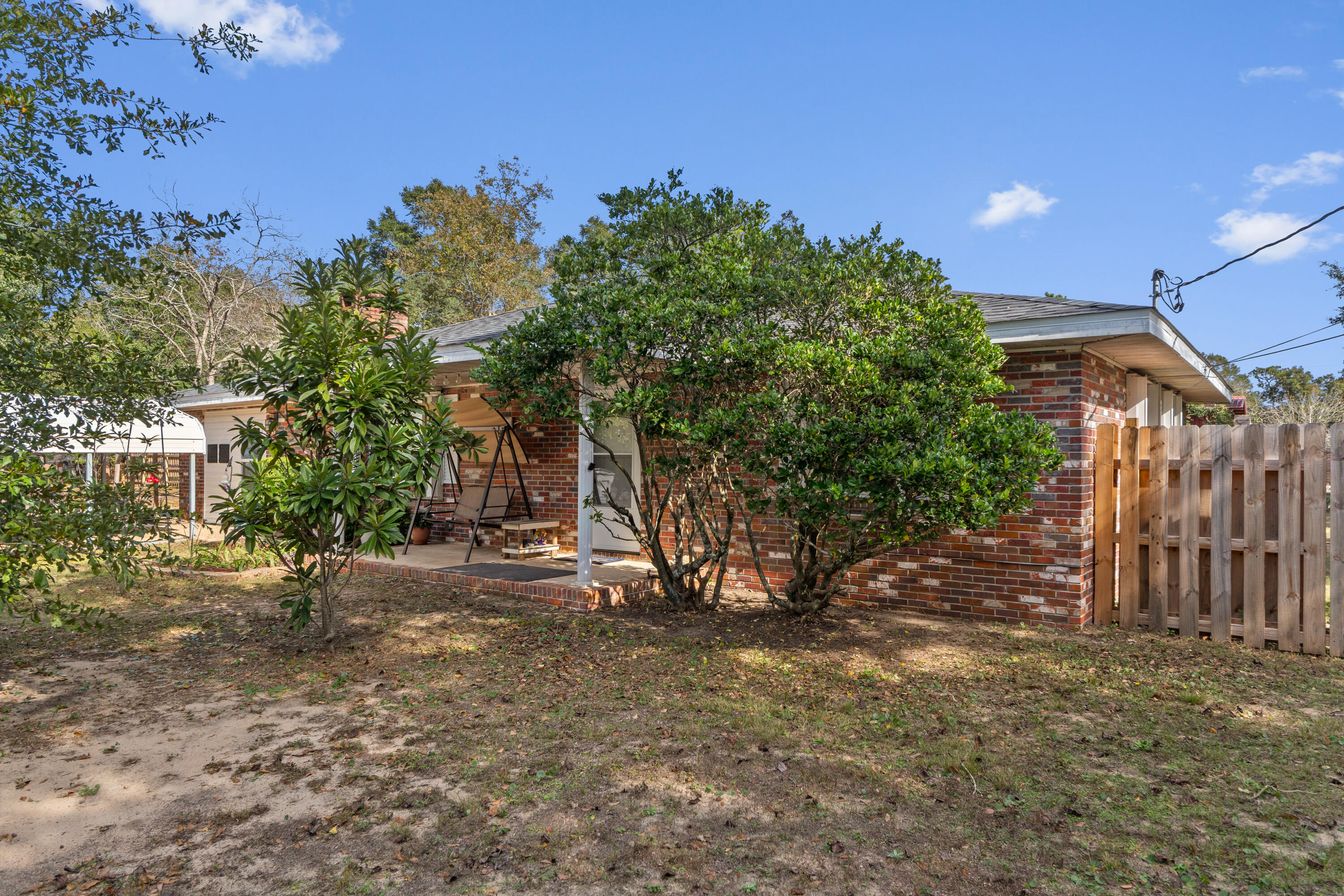 4320 Reinsma Road Milton, FL 32583 - Photo 7 of 41 a backyard of a house with lots of green space