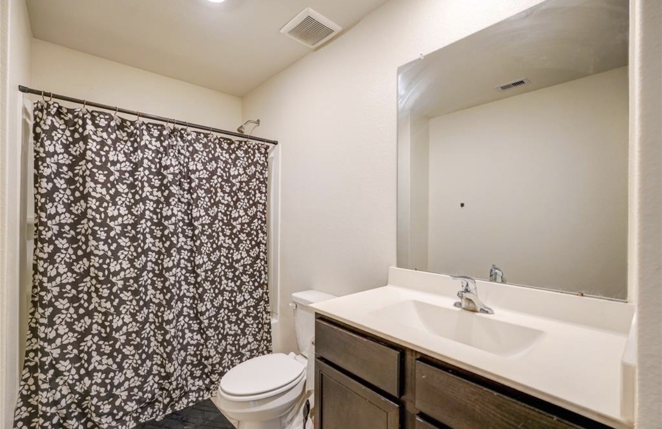 7943 Vacek Meadows Loop Richmond, TX 77469 - Photo 22 of 36 a bathroom with a sink toilet and shower