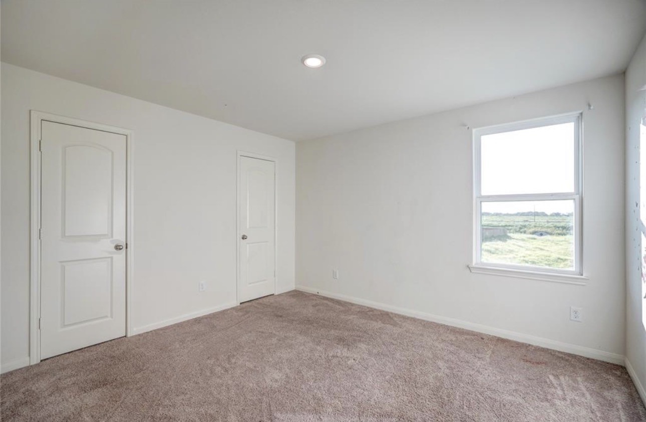 7943 Vacek Meadows Loop Richmond, TX 77469 - Photo 23 of 36 a view of an empty room and a window