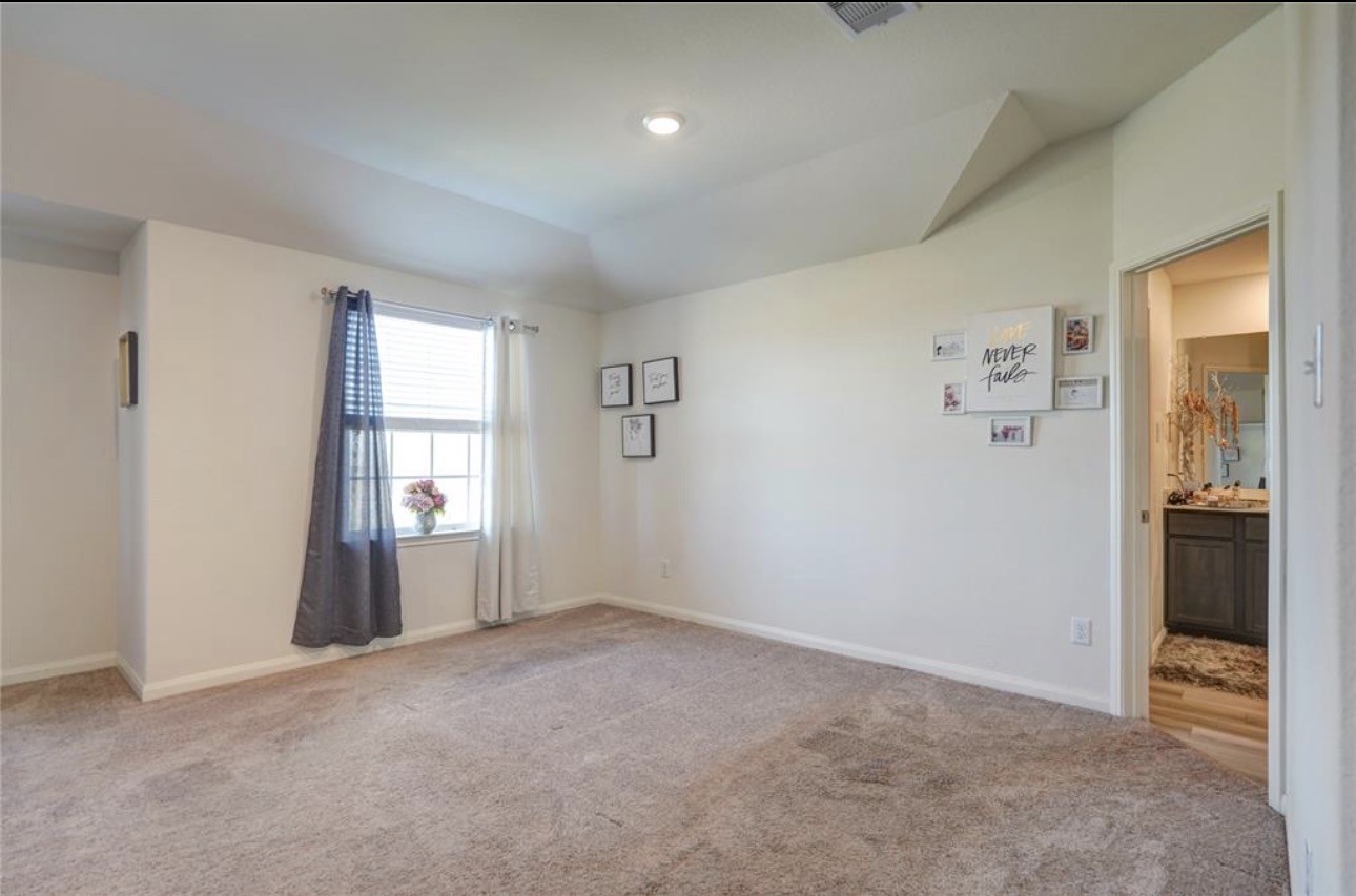 7943 Vacek Meadows Loop Richmond, TX 77469 - Photo 26 of 36 an empty room with windows and closet