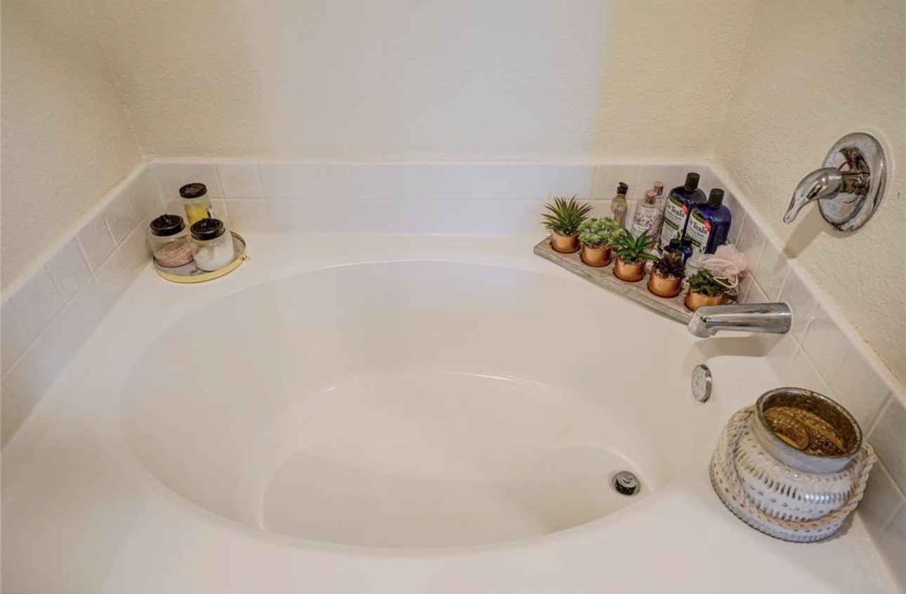 7943 Vacek Meadows Loop Richmond, TX 77469 - Photo 30 of 36 a bath tub sitting next to a white sink