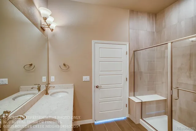 a bathroom with a tub and shower