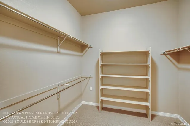 a view of an empty walk in closet