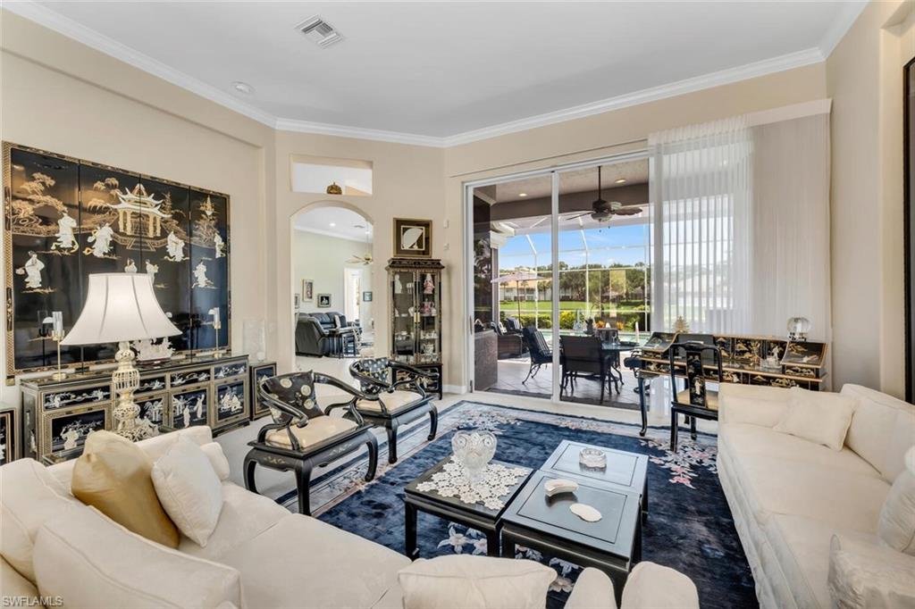 1624 Manchester Court Naples, FL 34109 - Photo 19 of 30 a living room with furniture and a large window