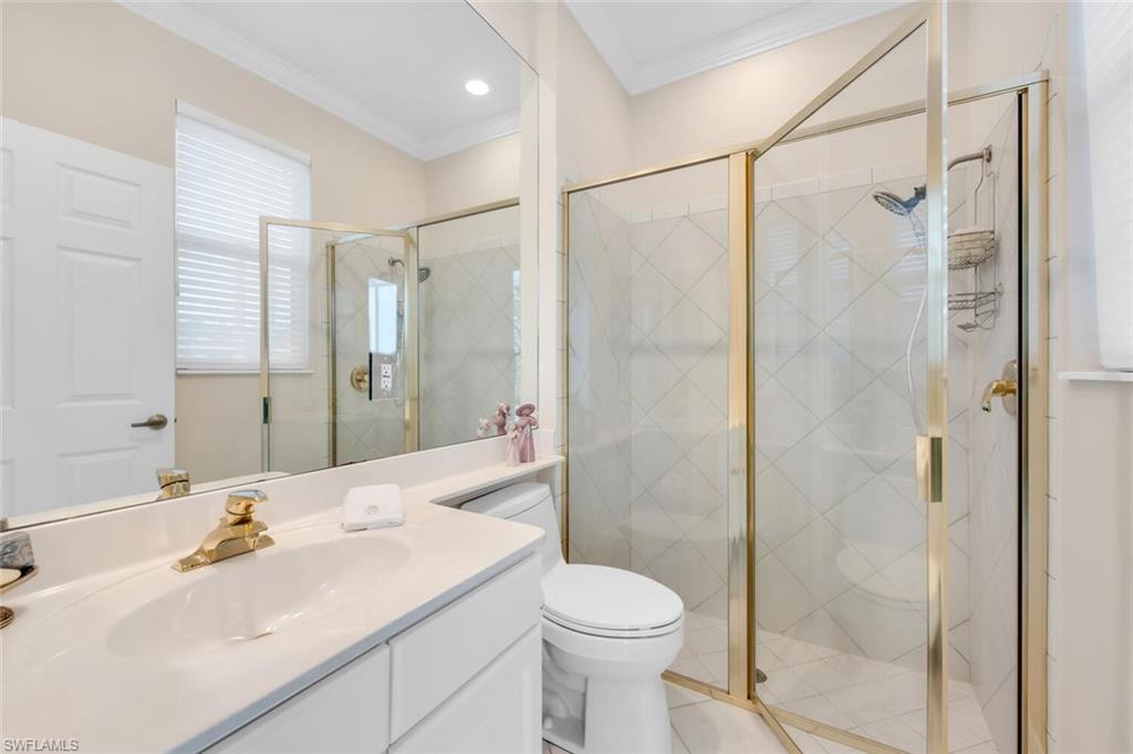 1624 Manchester Court Naples, FL 34109 - Photo 21 of 30 a bathroom with a sink toilet and shower