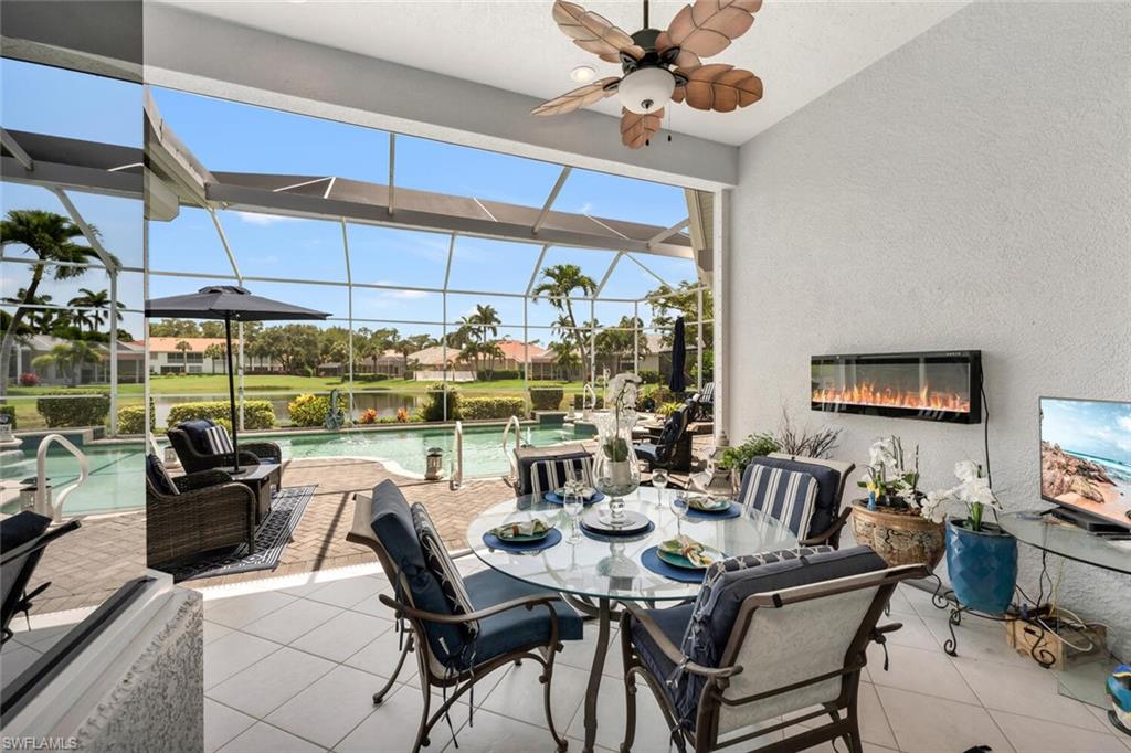 1624 Manchester Court Naples, FL 34109 - Photo 23 of 30 a view of a dining room with furniture window and outside view