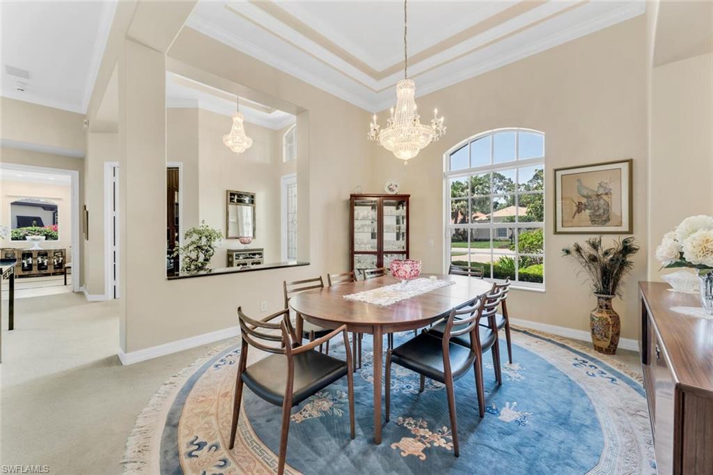1624 Manchester Court Naples, FL 34109 - Photo 5 of 30 a view of a dining room with furniture window and wooden floor