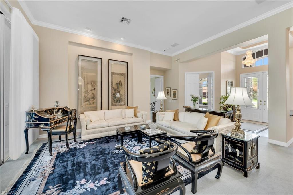 1624 Manchester Court Naples, FL 34109 - Photo 6 of 30 a living room with furniture and a large window