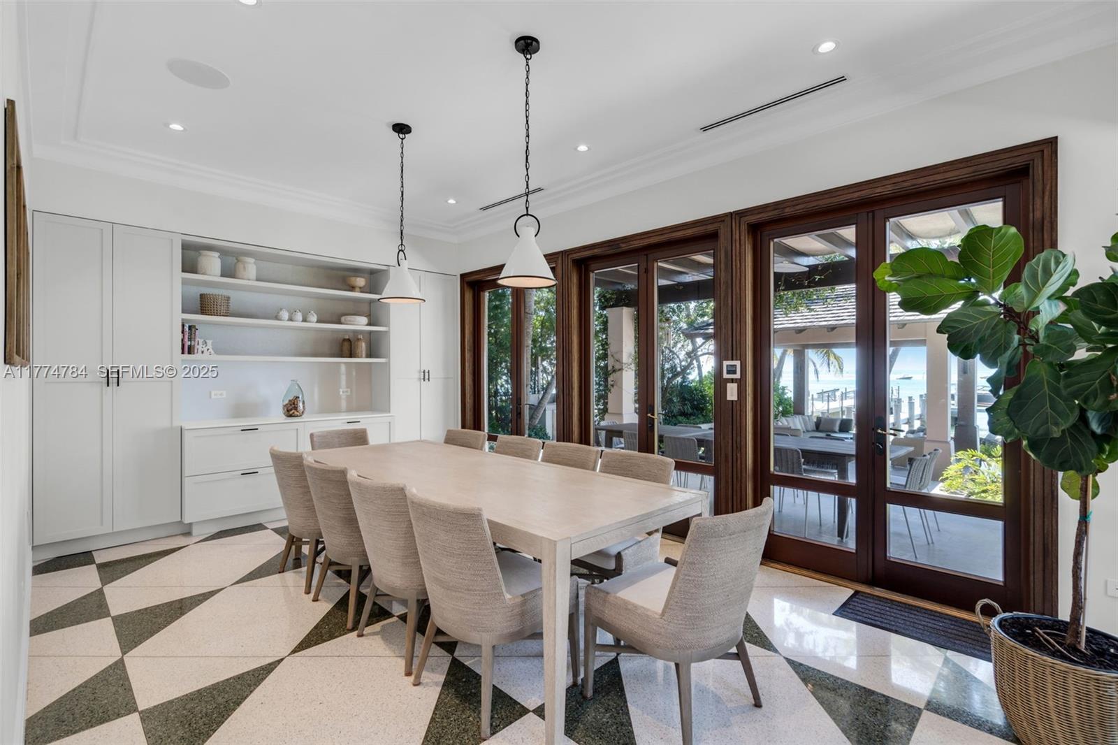 9 Harbor Point Key Biscayne, FL 33149 - Photo 13 of 88 a view of a dining room with furniture large windows and wooden floor