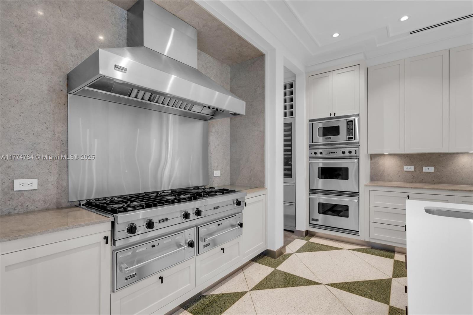 9 Harbor Point Key Biscayne, FL 33149 - Photo 14 of 88 a kitchen with granite countertop a stove and a refrigerator