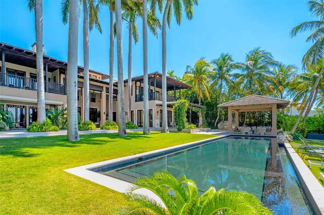 a bedroom with a large bed and a couch