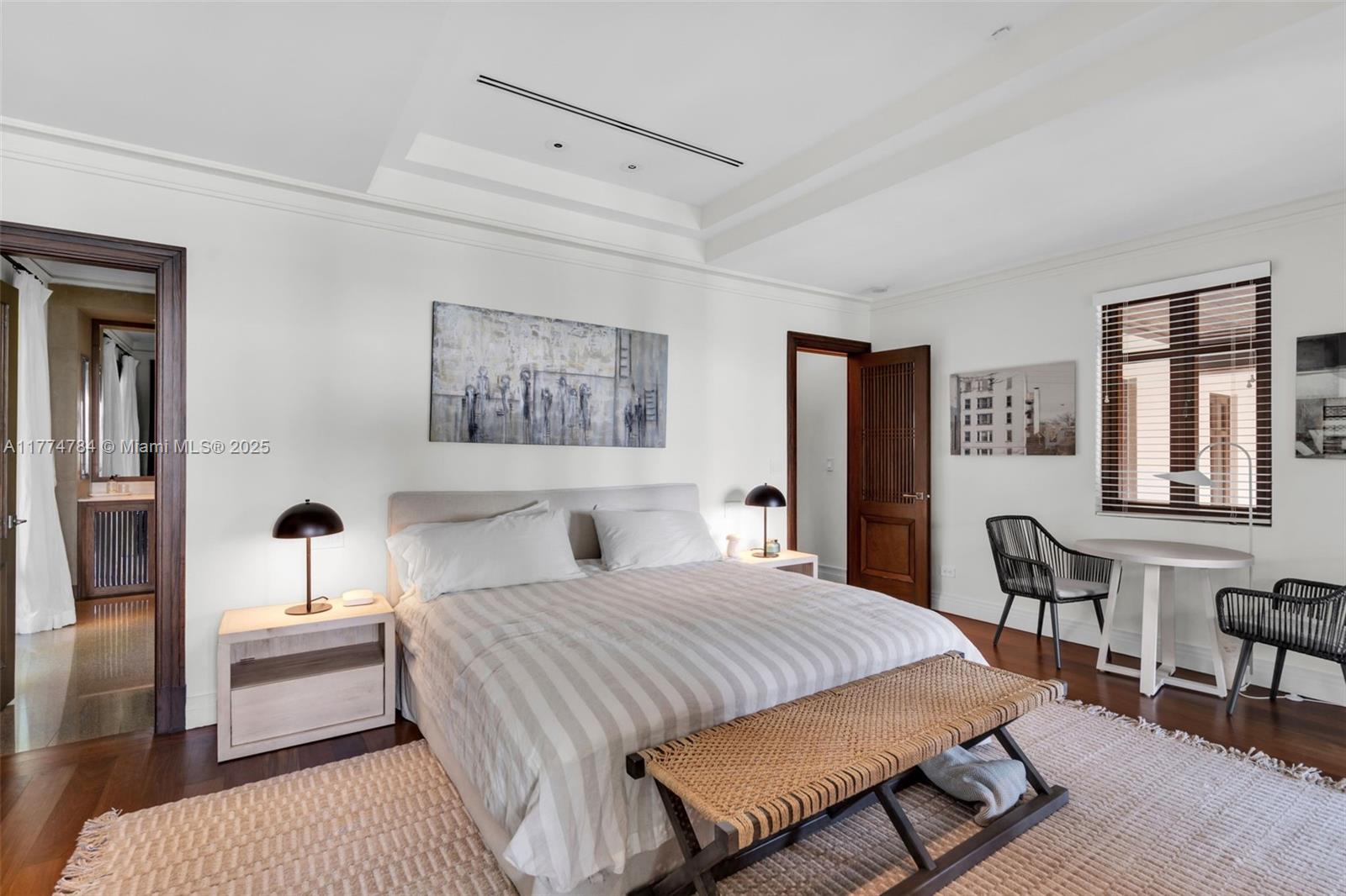 9 Harbor Point Key Biscayne, FL 33149 - Photo 38 of 88 a bedroom with a bed and wooden floor