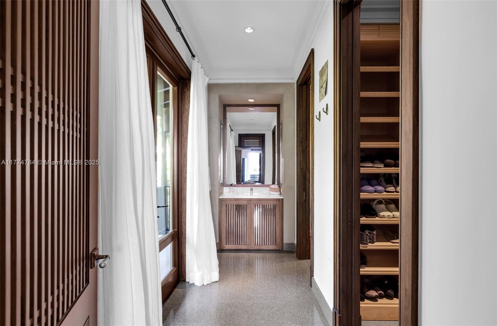 9 Harbor Point Key Biscayne, FL 33149 - Photo 40 of 88 a view of a hallway with wooden shelves