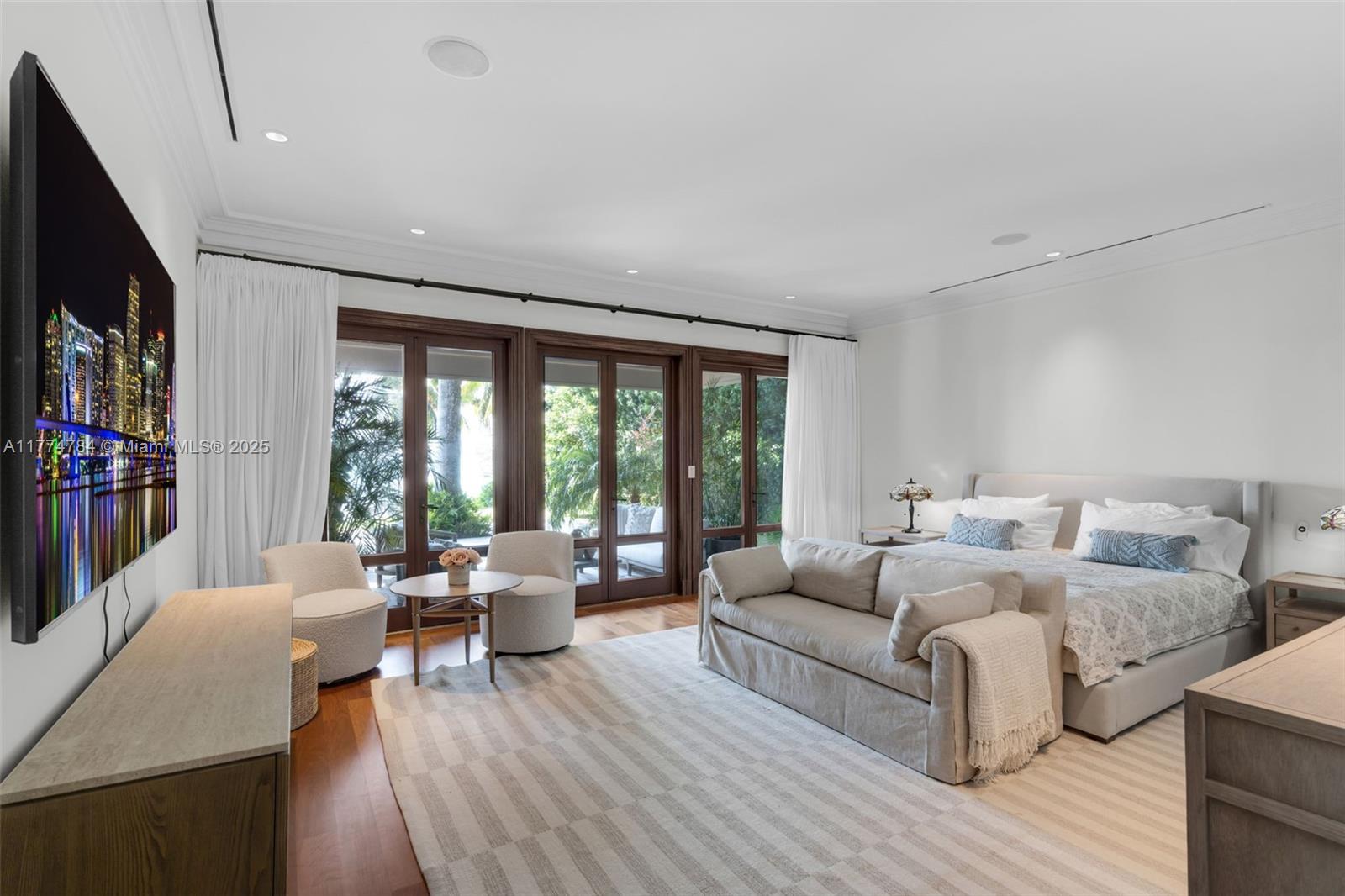 9 Harbor Point Key Biscayne, FL 33149 - Photo 41 of 88 a living room with furniture and a flat screen tv