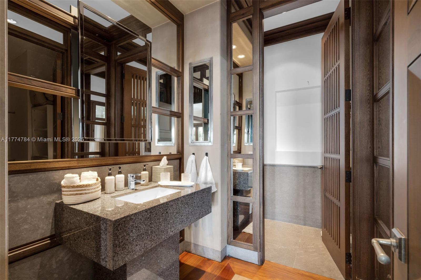 9 Harbor Point Key Biscayne, FL 33149 - Photo 43 of 88 a bathroom with a sink and a mirror