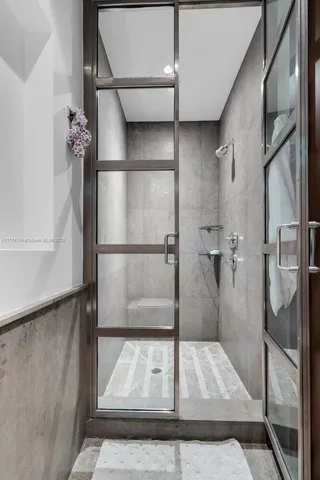 a bathroom with a toilet a sink and a mirror