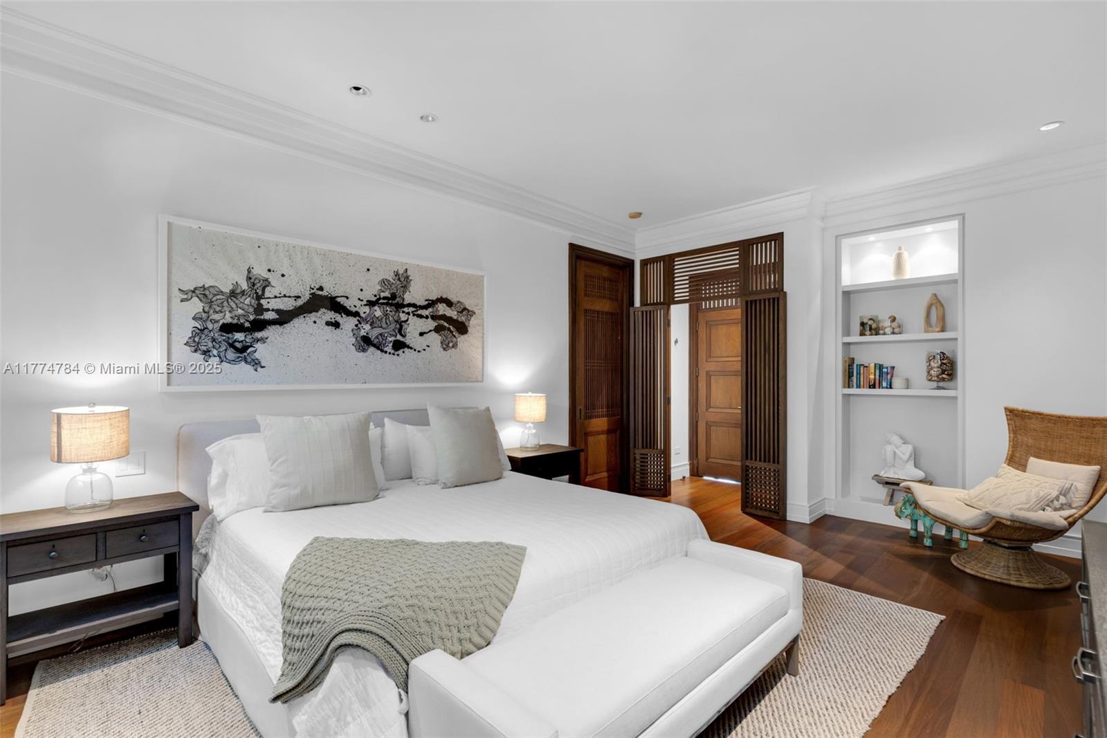 9 Harbor Point Key Biscayne, FL 33149 - Photo 46 of 88 a bedroom with a bed and wooden floor