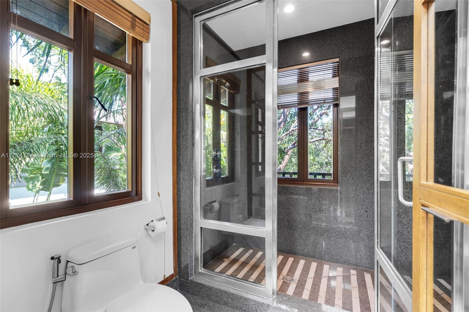 9 Harbor Point Key Biscayne, FL 33149 - Photo 51 of 88 a bathroom with a bathtub and a shower