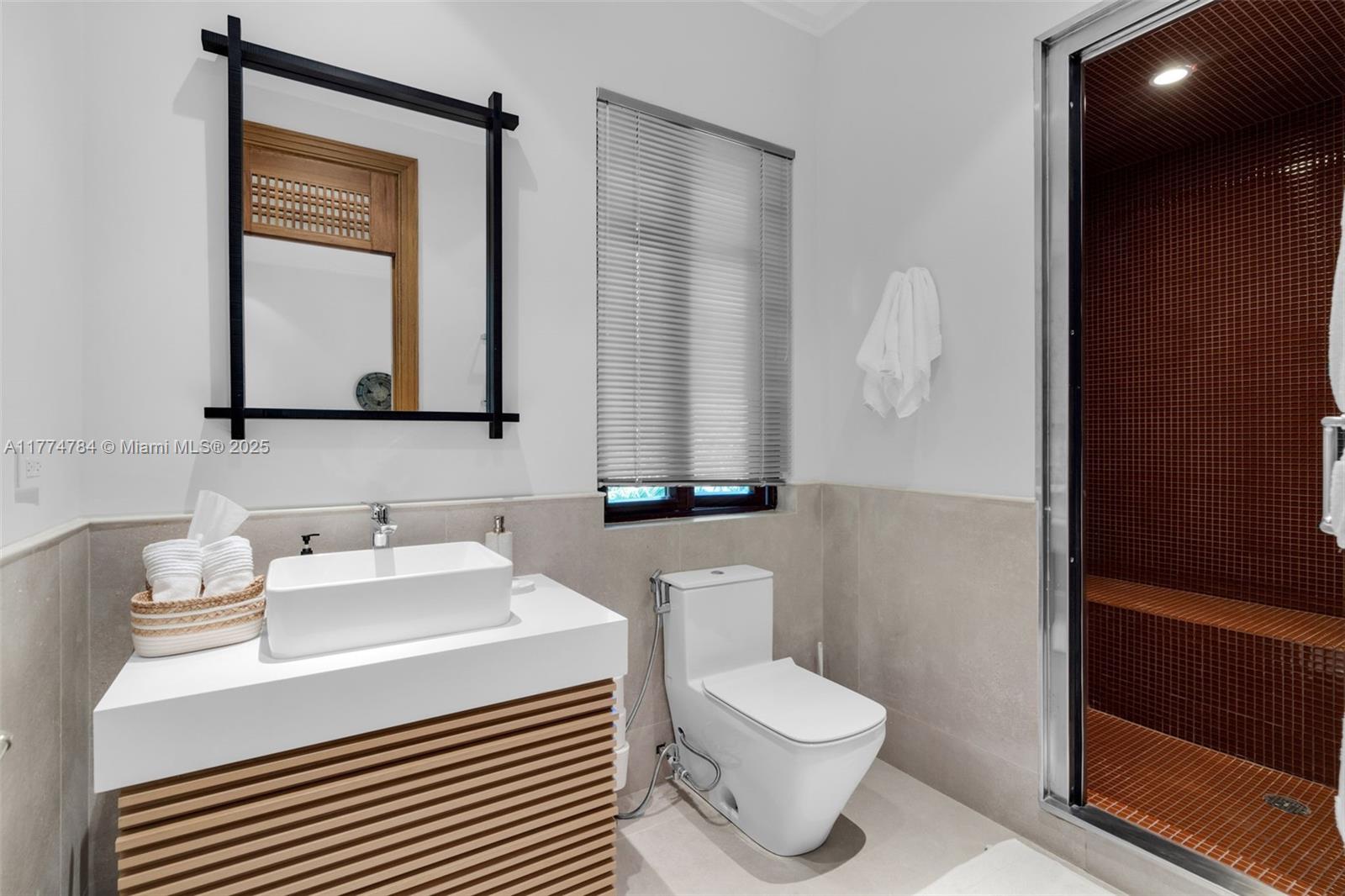 9 Harbor Point Key Biscayne, FL 33149 - Photo 53 of 88 a bathroom with a sink a toilet and mirror