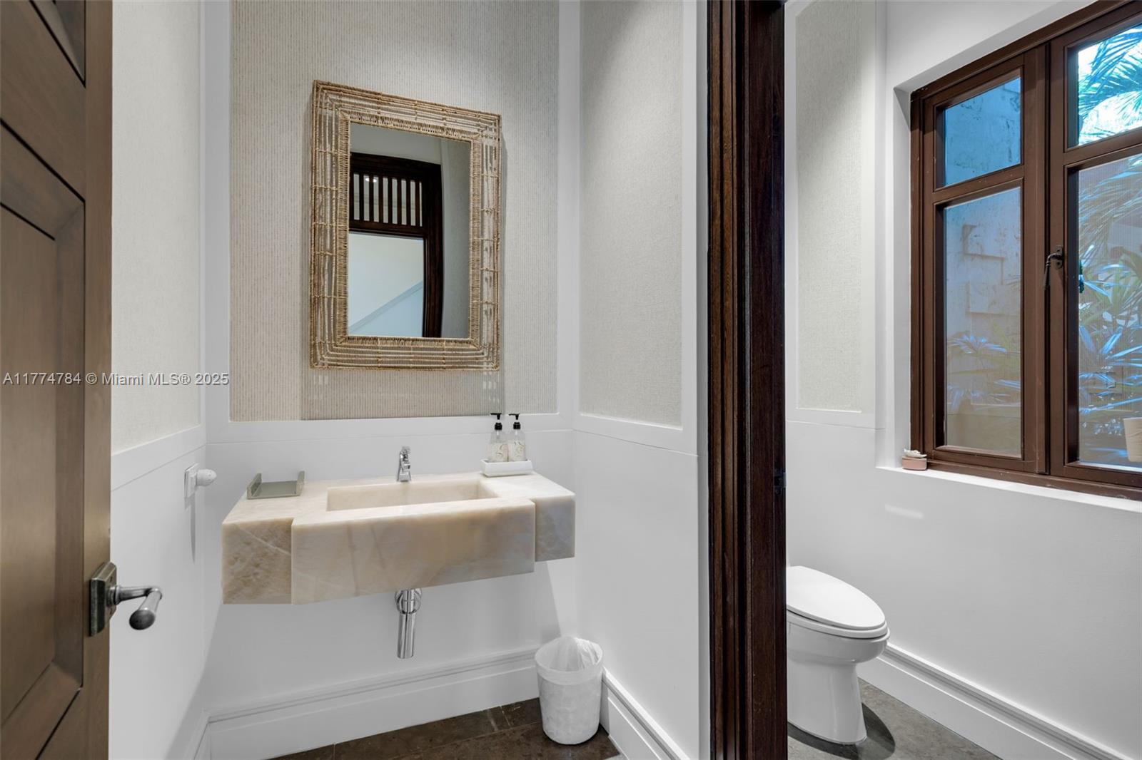 9 Harbor Point Key Biscayne, FL 33149 - Photo 55 of 88 a bathroom with a sink toilet and a mirror