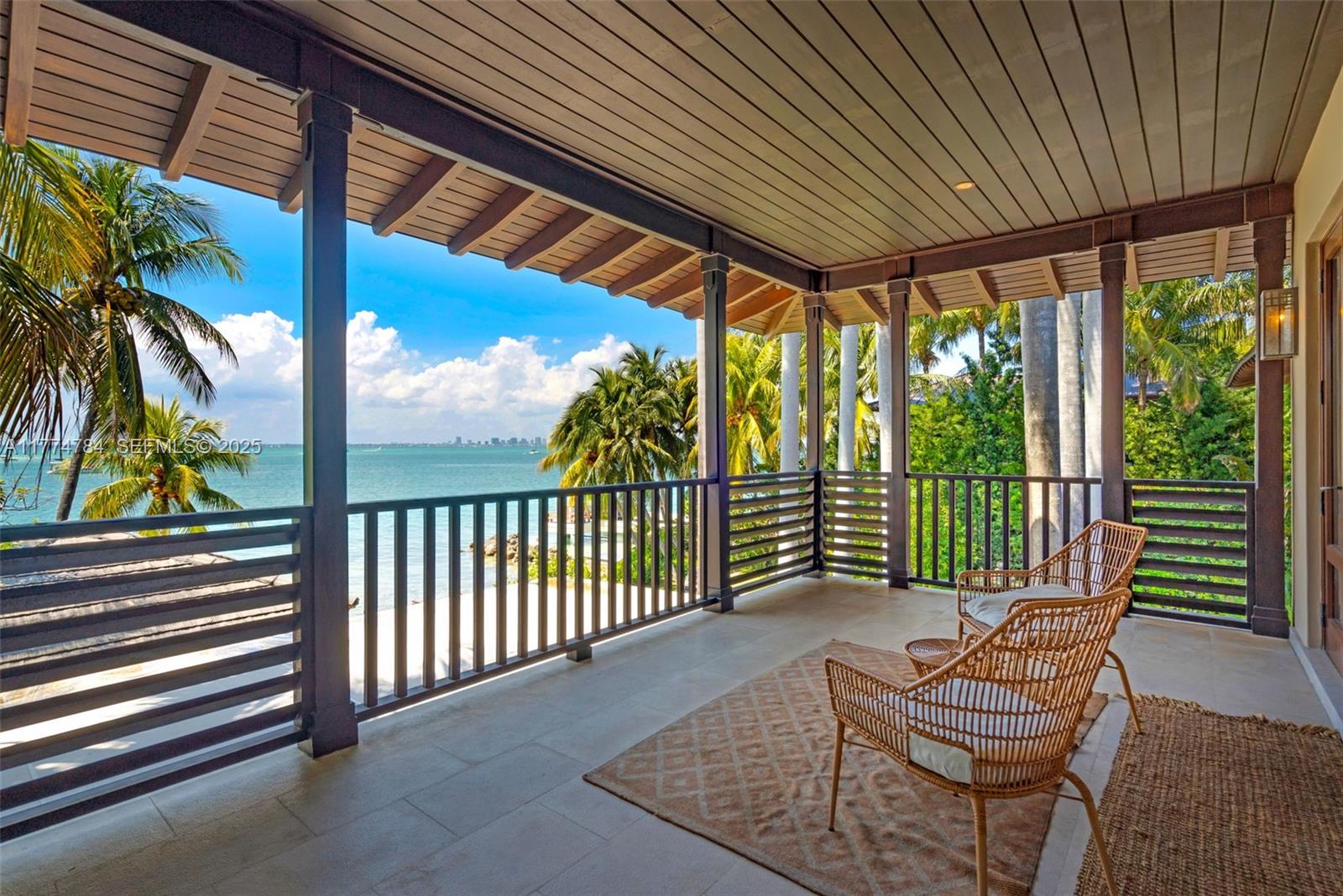 9 Harbor Point Key Biscayne, FL 33149 - Photo 65 of 88 a balcony with chairs and with potted plants