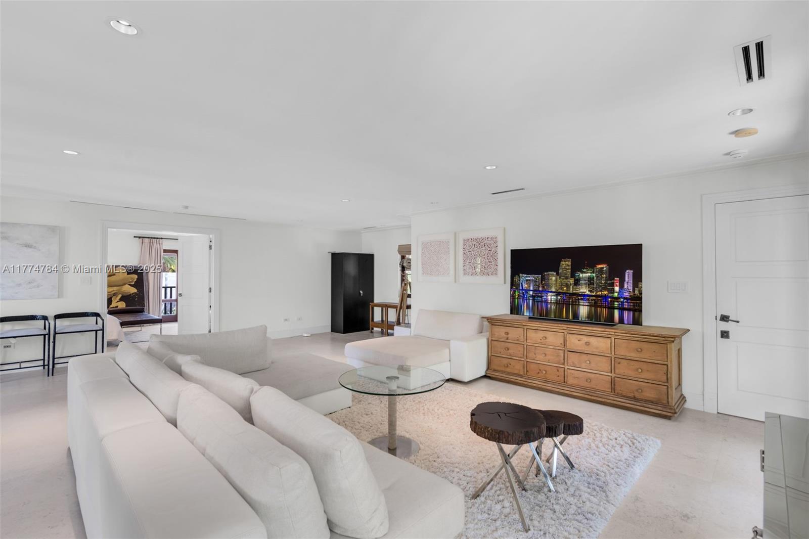 9 Harbor Point Key Biscayne, FL 33149 - Photo 68 of 88 a living room with furniture and a flat screen tv