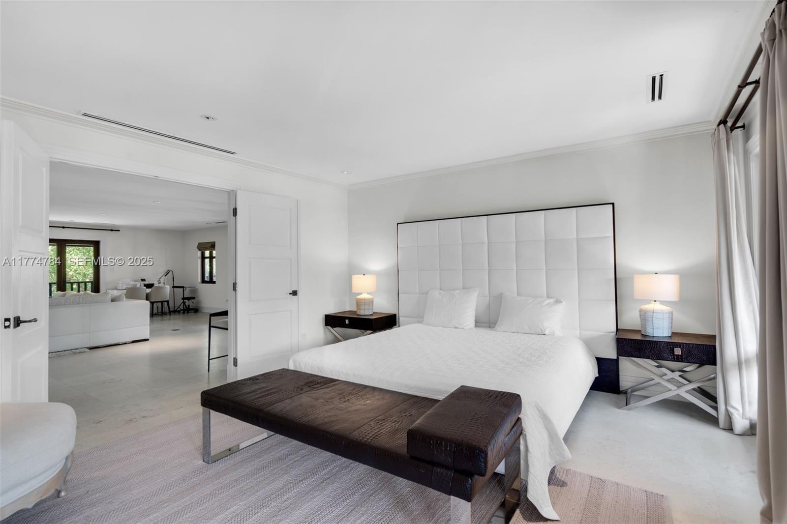 9 Harbor Point Key Biscayne, FL 33149 - Photo 70 of 88 a bedroom with a bed and a couch
