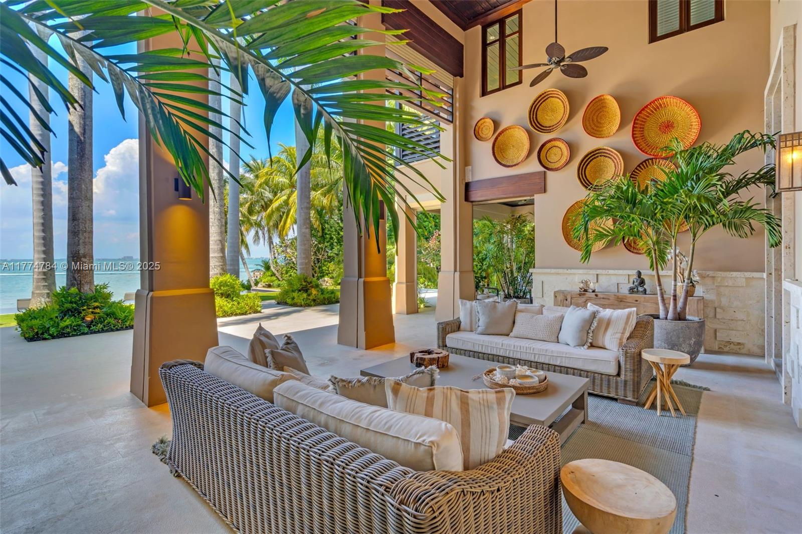 9 Harbor Point Key Biscayne, FL 33149 - Photo 7 of 88 a view of a patio with couches and table and chairs with wooden fence