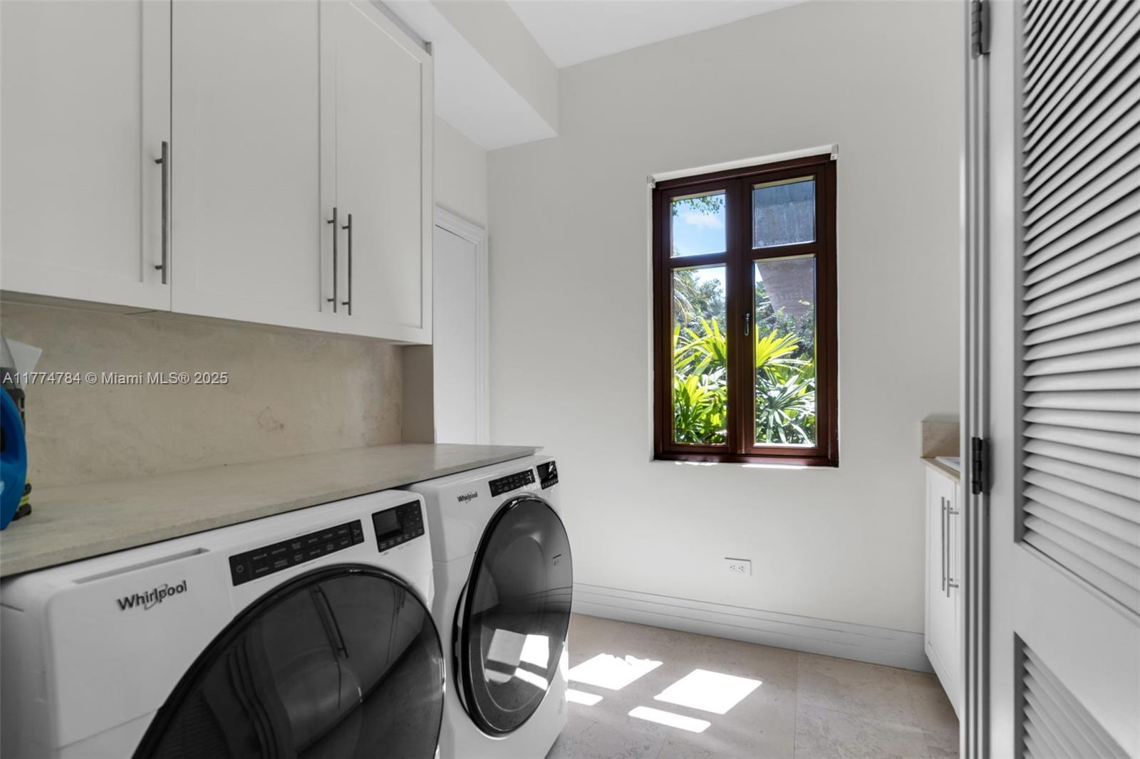 9 Harbor Point Key Biscayne, FL 33149 - Photo 76 of 88 a utility room with dryer and washer