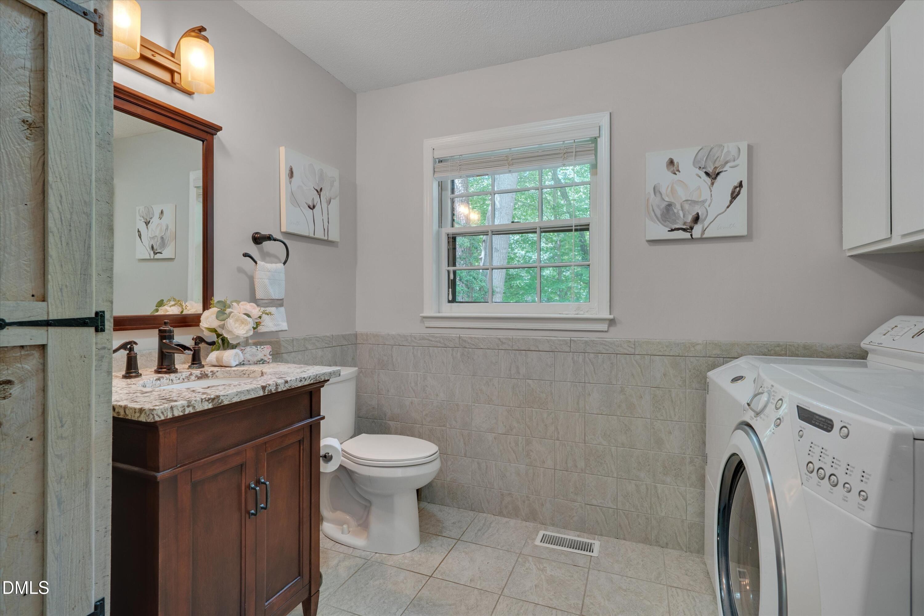 641 Kings Fork Road Cary, NC 27511 - Photo 9 of 21 Laundry & Half Bath on the First Floor