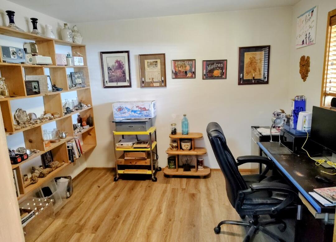 298 Main Street Monument, OR 97864 - Photo 23 of 66 a view of a workspace with furniture and wooden floor