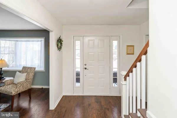 a view of a livingroom with furniture and wooden floor