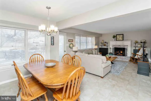 a living room with furniture a rug and a fireplace