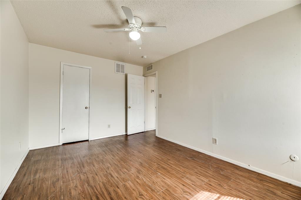 106 East Cedar Street, Unit 12 Arlington, TX 76011 - Photo 11 of 18 wooden floor in an empty room