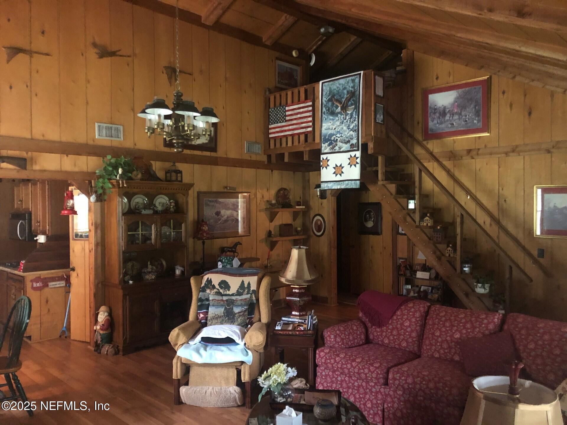 43270 Ratliff Road Callahan, FL 32011 - Photo 8 of 20 Living Room with stairs to loft