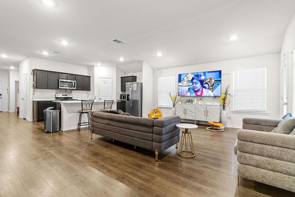 2928 Roper Street Royse City, TX 75189 - Photo 9 of 26 a living room with furniture and a flat screen tv