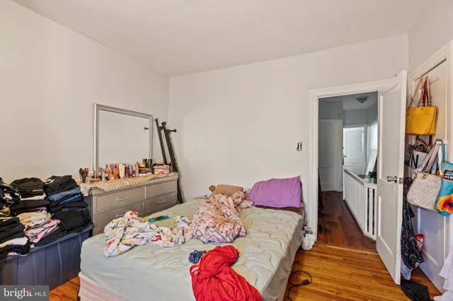 a bedroom with bed and a window