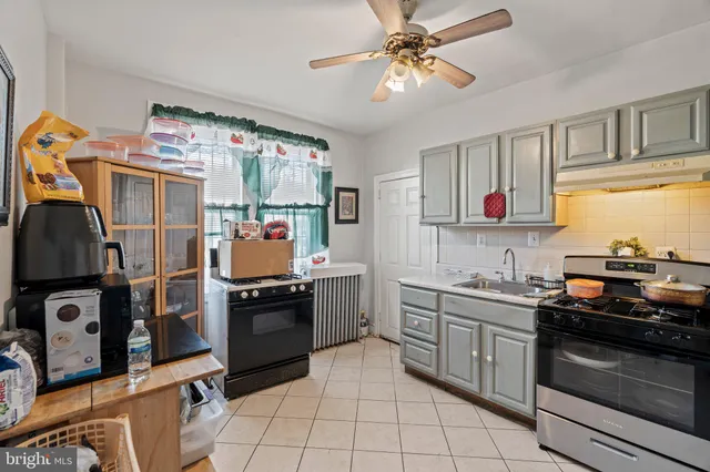 a kitchen with stainless steel appliances granite countertop a stove and a sink