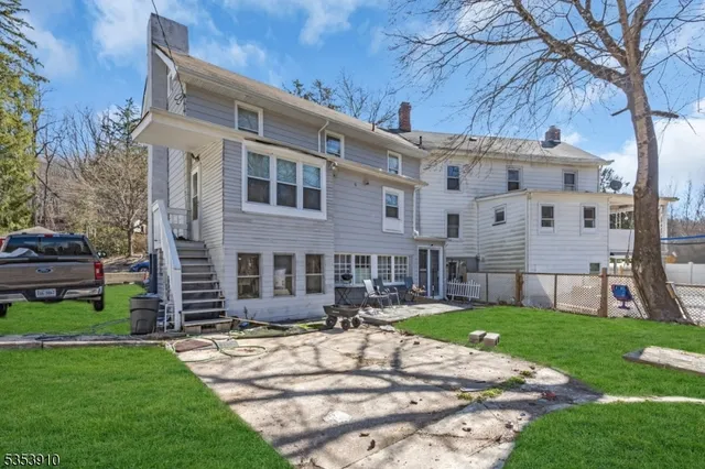 a view of a building with a yard