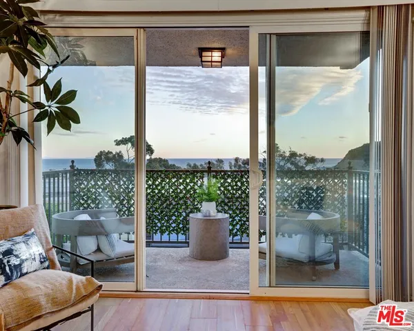 a view of a balcony with chair