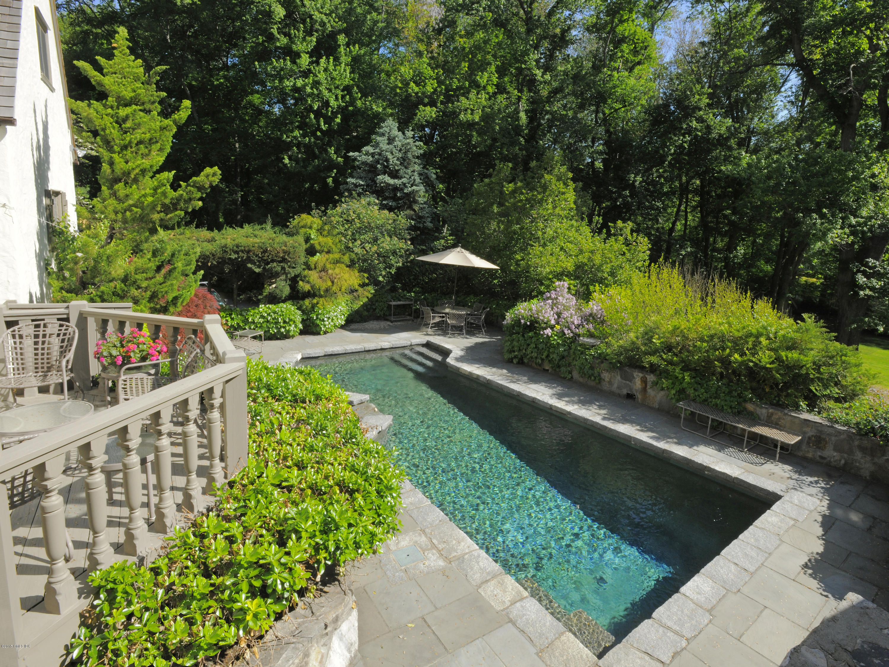 9 Frost Road Greenwich, CT 06830 - Photo 16 of 29 a view of a pathway with a flower garden