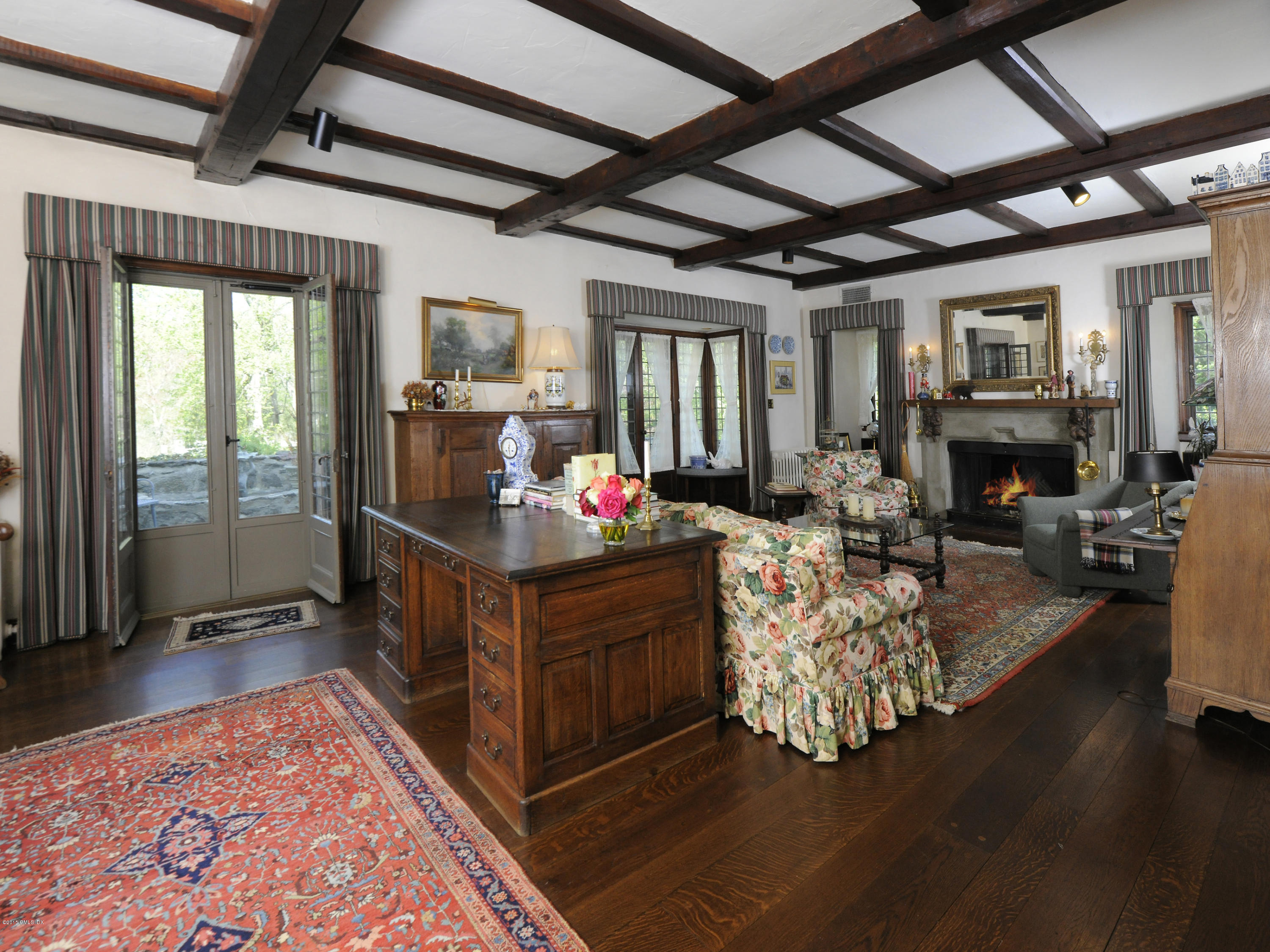 9 Frost Road Greenwich, CT 06830 - Photo 5 of 29 a bed room with furniture and a fireplace