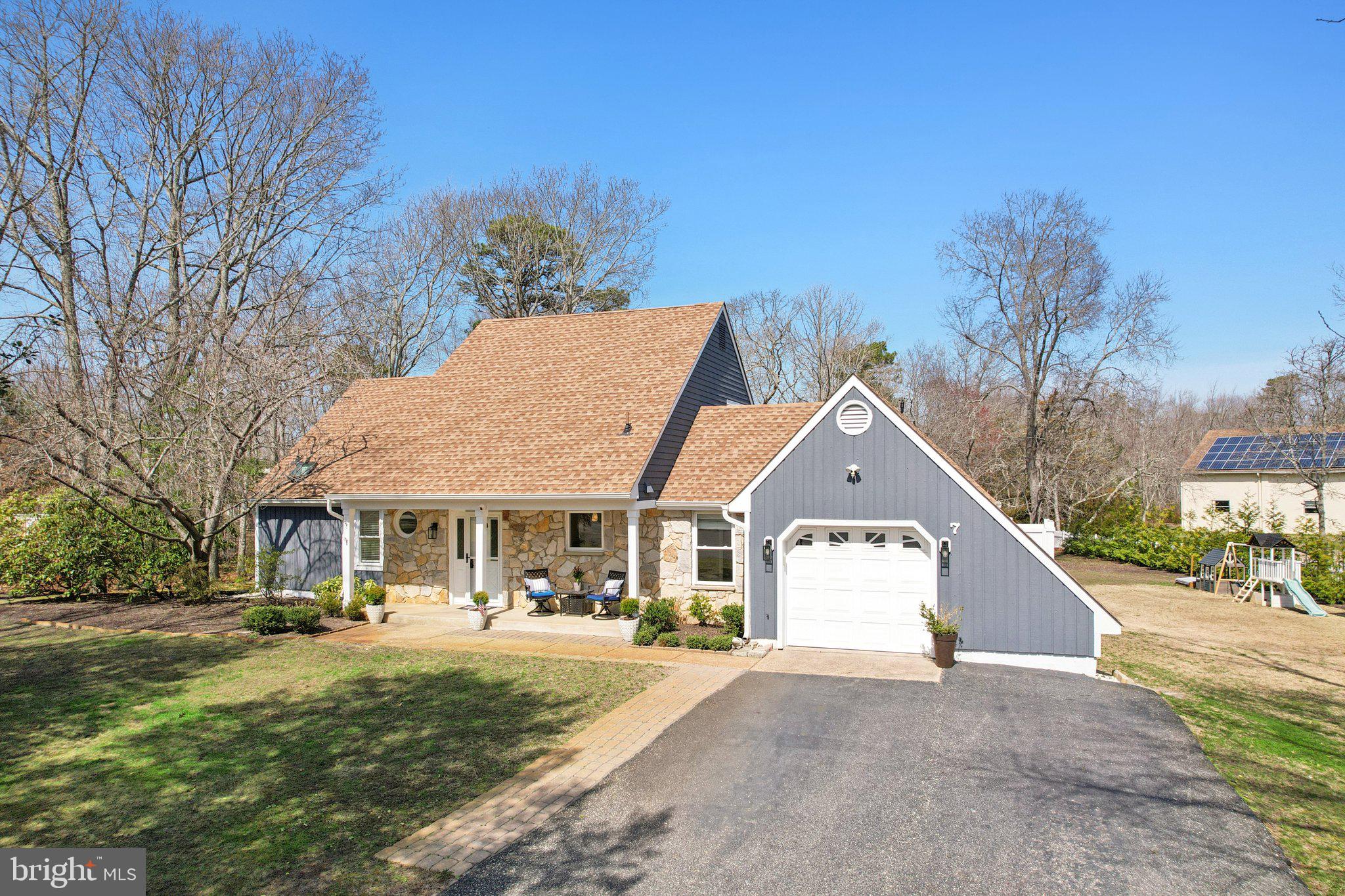 7 Inlet Terrace Ocean View, NJ 08230 - Photo 1 of 1 a front view of a house with a yard and garage